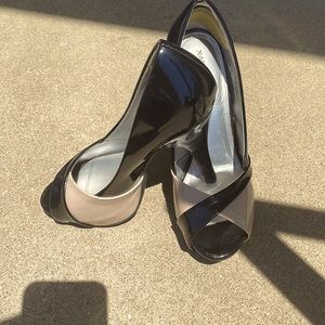 Beautiful open toe Pumps  Black and Tan. Used only once